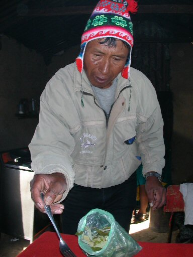 Juan Quispe makes breakfast in Amantani